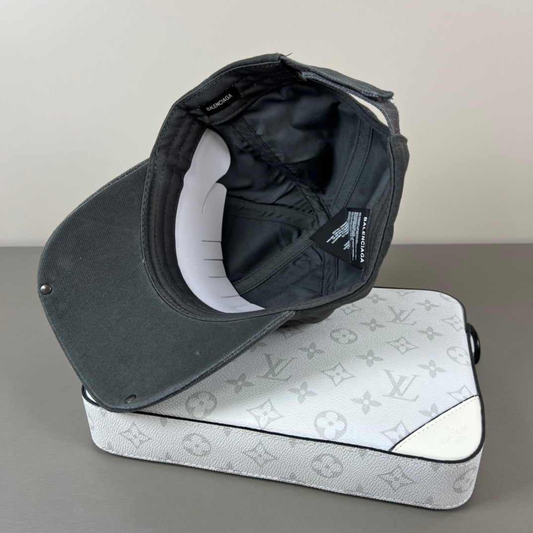 Washed black metal patch cap with glossy shield brim
